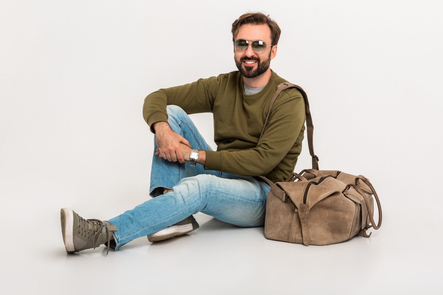The Ultimate Guide to Building a Versatile Wardrobe for Every Occasion Hansome Bearded Stylish Man Sitting On Floor U8C62KR